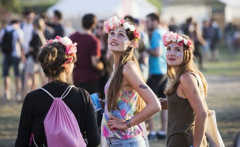 Festival goers attend the 18th edition of the Solidays music festival in Paris