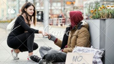 Young woman giving money